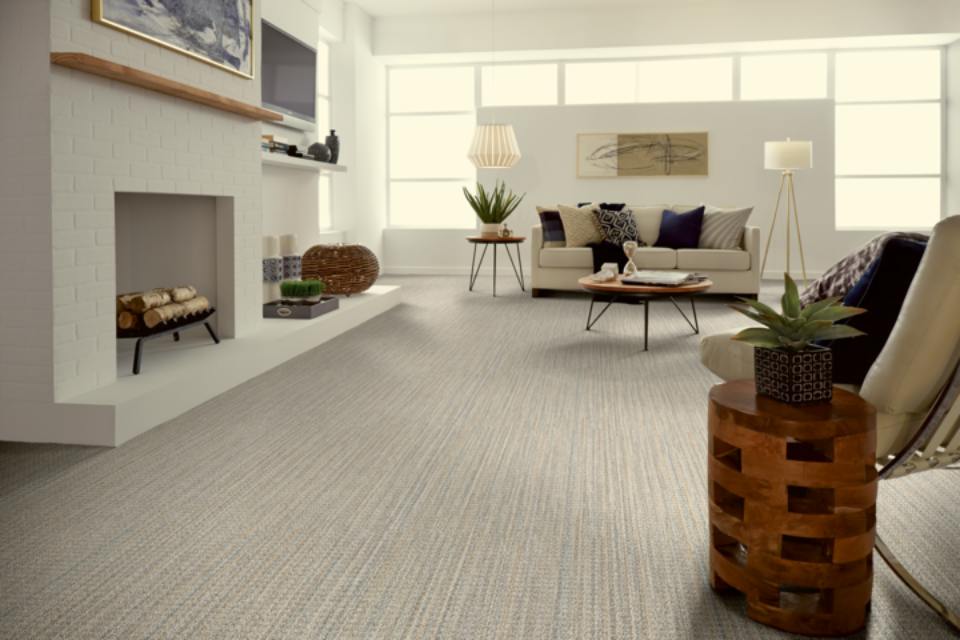 grey patterned carpet in living room with modern wood and light decor.